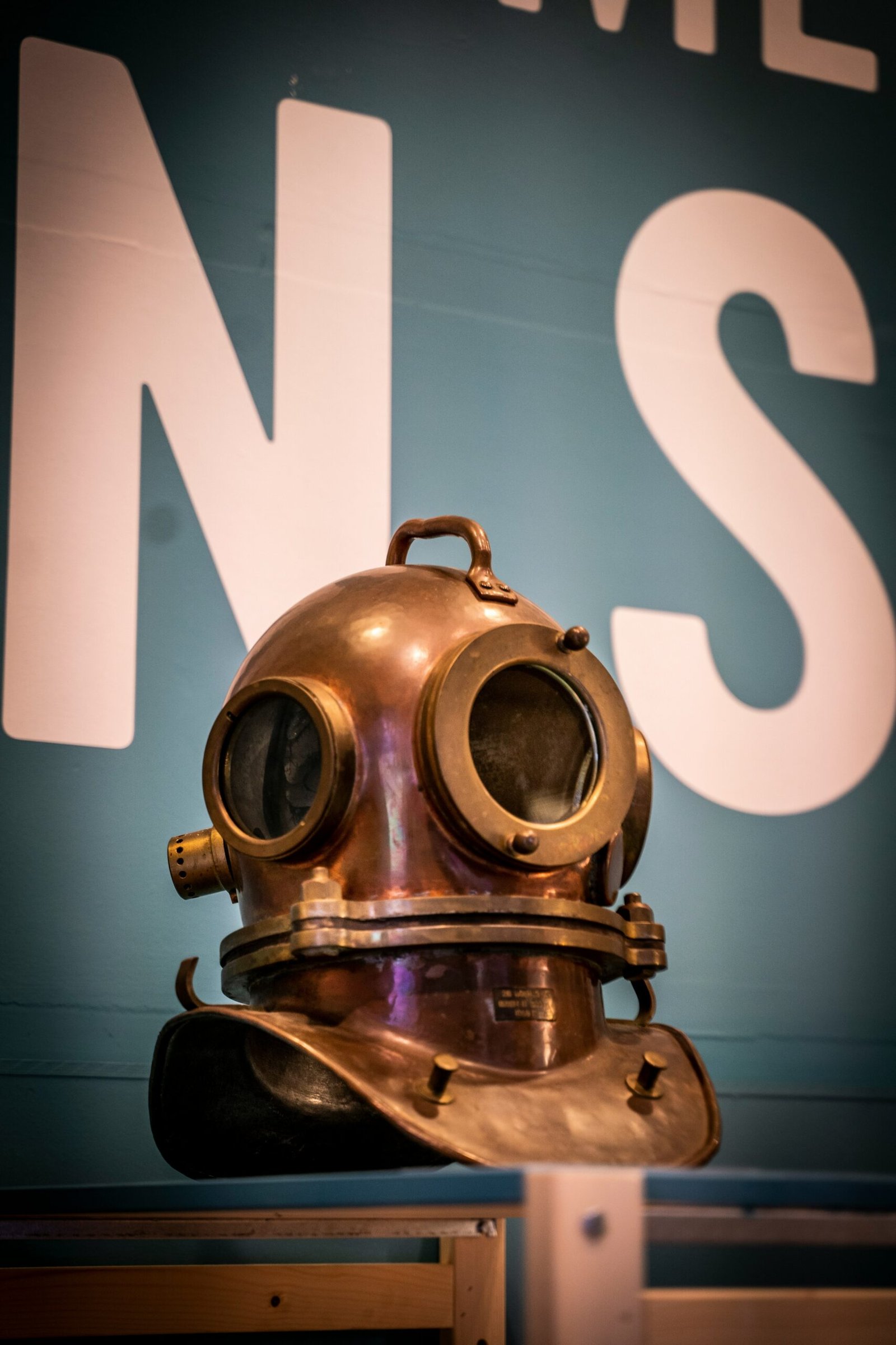 a diving helmet on display in a museum